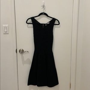 Black sleeveless dress, above knee